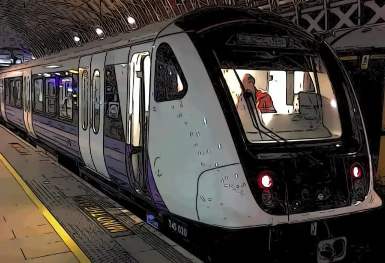 a new elizabeth line train shortly arriving at Canary Wharf’s crossrail place station