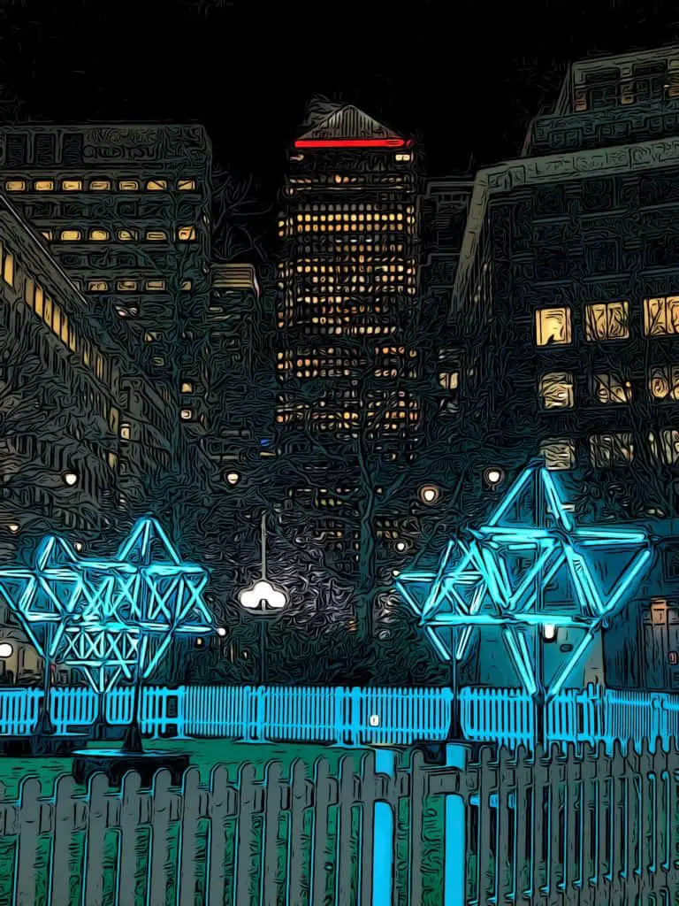 Winter light festival exhibit showing lit up stars in front of One Canada Square in Canary Wharf