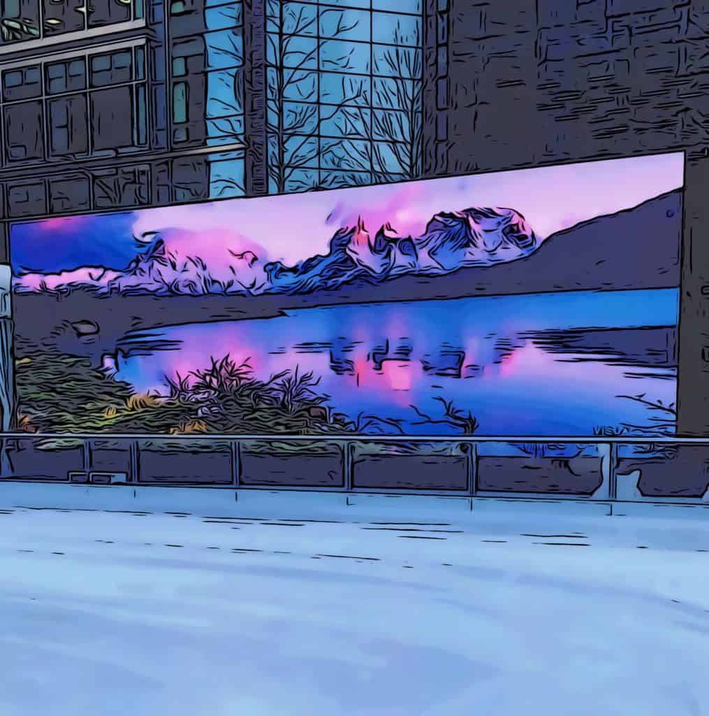 HD screens displaying scenic views around canary wharf ice rink
